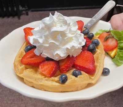 waffle w berries and whipped cream